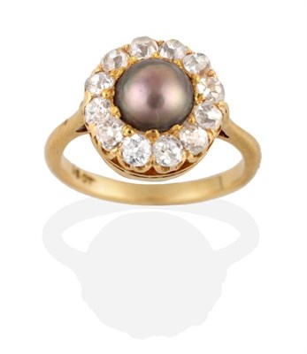 Lot 208 - A Pearl and Diamond Cluster Ring, a brown grey pearl within a cluster of old cut diamonds, to knife