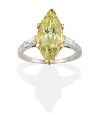 Lot 220 - A Chrysoberyl and Diamond Ring, a marquise cut chrysoberyl in a claw setting, to baguette cut...