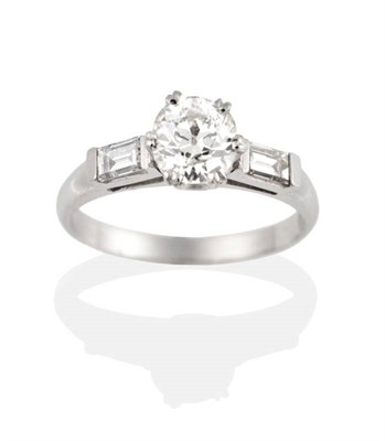 Lot 223 - A Solitaire Diamond Ring, an old cut diamond in a double claw setting, to baguette cut diamond...