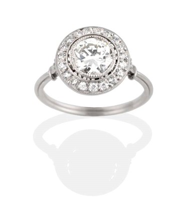 Lot 234 - An Art Deco Style Diamond Cluster Ring, a grain set old cut diamond within a diamond set halo...
