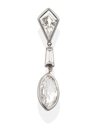 Lot 253 - A Diamond Pendant, a kite cut diamond suspends a tapered baguette cut diamond and a marquise...