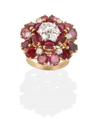 Lot 257 - A Ruby and Diamond Cluster Ring, a cluster of round brilliant cut diamonds in claw settings...