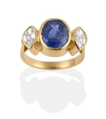 Lot 259 - A Sapphire and Diamond Three Stone Ring, an oval cut sapphire spaced by marquise cut diamonds...