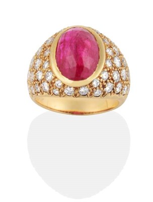 Lot 262 - A Ruby and Diamond Ring, an oval rose cut ruby in a rubbed over setting, to a tapering pavé...