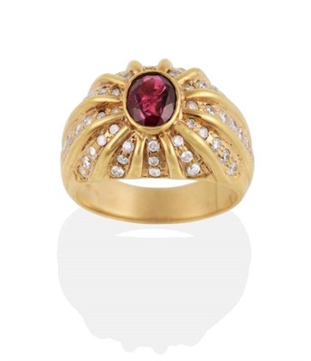 Lot 263 - A Ruby and Diamond Ring, an oval cut ruby in a rubbed over setting within a domed shank pavé...