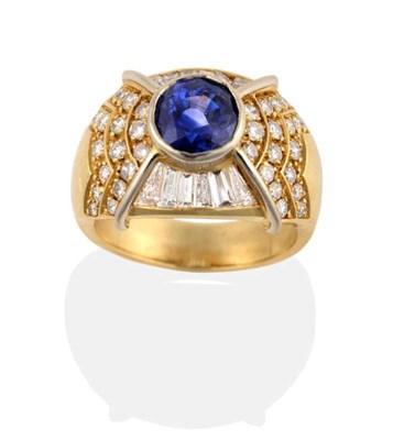 Lot 270 - A Sapphire and Diamond Cluster Ring, a round cut sapphire in a rubbed over setting to a domed shank