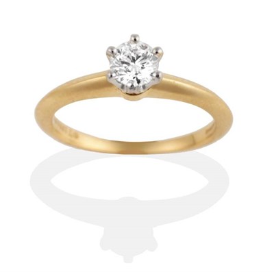 Lot 271 - An 18 Carat Gold Solitaire Diamond Ring, by Tiffany, a round brilliant cut diamond in a claw...
