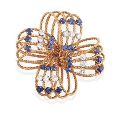 Lot 273 - A Circa 1960s Sapphire and Diamond Bow Brooch, groups of three round cut sapphires alternating with