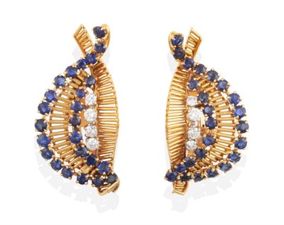 Lot 275 - A Pair of French 1950s 18 Carat Gold Sapphire and Diamond Clip Earrings, bar scrolls with rows...
