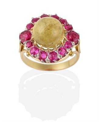 Lot 277 - A Circa 1920s Art Deco Chrysoberyl and Ruby Cluster Ring, a round cabochon chrysoberyl in a...