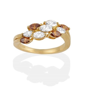 Lot 279 - A Diamond Ring, marquise cut white and fancy brown coloured diamonds in claw settings as an...