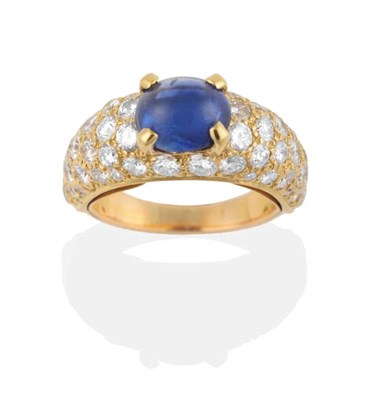 Lot 284 - A Sapphire and Diamond Ring, an oval cabochon sapphire in a claw setting, to a tapering shank pavé