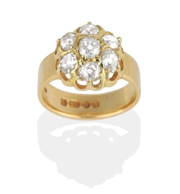 Lot 286 - An 18 Carat Gold Diamond Cluster Ring, seven old cut diamonds in extended claw settings, to a broad