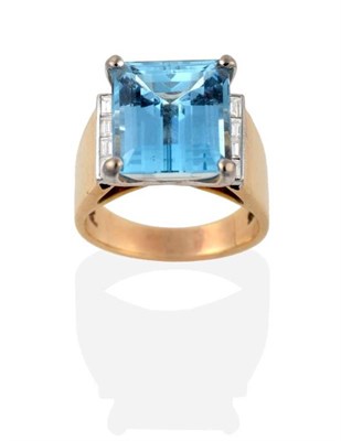 Lot 298 - An Aquamarine and Diamond Ring, an octagonal cut aquamarine in a claw setting, to channel set...