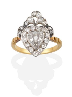 Lot 310 - A Victorian Diamond Heart Ring, a grain set old heart cut diamond within a border of old cut...