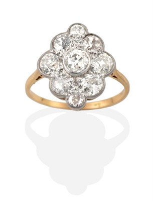 Lot 312 - An Early Twentieth Century Diamond Cluster Ring, an old cut diamond in a rubbed over setting,...