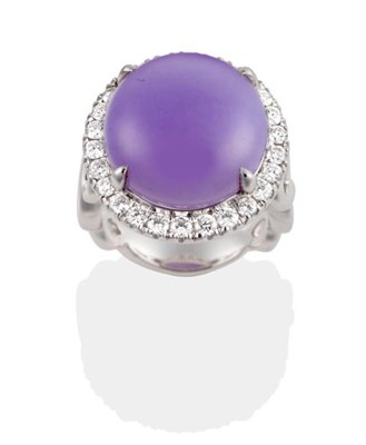 Lot 317 - A Lavender Jade and Diamond Cluster Ring, a round cabochon lavender jade in a claw setting,...