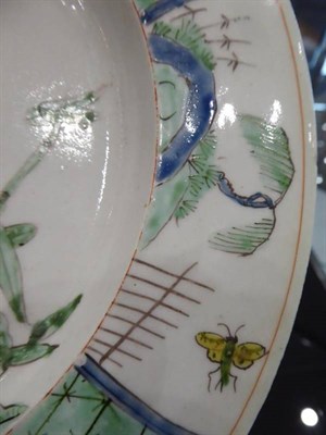 Lot 327 - An Early Worcester Porcelain Plate, circa 1752, painted in famille verte style with a bird...