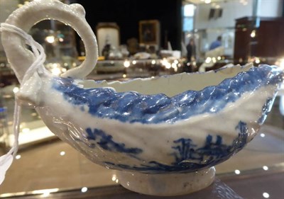 Lot 329 - A Longton Hall Porcelain Cos Lettuce Sauce Boat, circa 1755, painted in underglaze blue with...