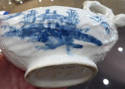 Lot 329 - A Longton Hall Porcelain Cos Lettuce Sauce Boat, circa 1755, painted in underglaze blue with...