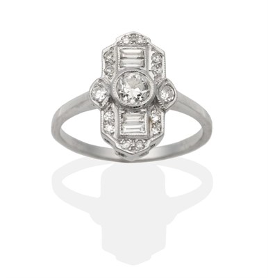 Lot 343 - An Art Deco Style Diamond Ring, an old cut diamond spaced by channel set baguette cut diamonds...