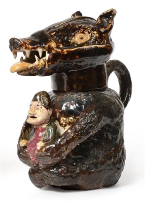 Lot 334 - A Staffordshire Pottery Bear Jug, circa 1810, naturalistically modelled seated holding a caricature