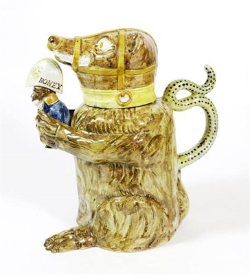 Lot 339 - A Pratt Type Bear Jug and Cover, early 19th century, the seated animal with brown markings and...