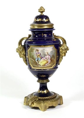 Lot 348 - A Gilt Metal Mounted Sèvres Style Porcelain Urn Shaped Vase and Cover, with Bacchus mask...