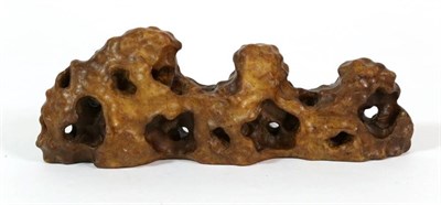 Lot 366 - A Yellow Wax Stone Scholar's Rock (Gongshi)/Brush Rest, of irregular horizontal form, 20cm wide