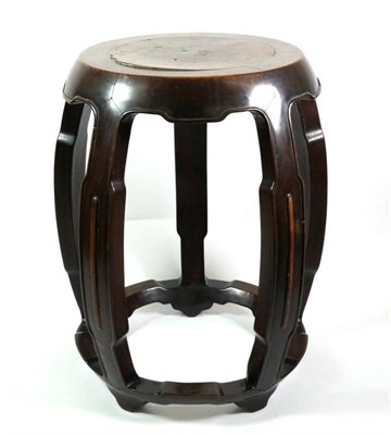 Lot 373 - A Chinese Hardwood Barrel Stool, Qing Dynasty, on five curving supports with peripheral...