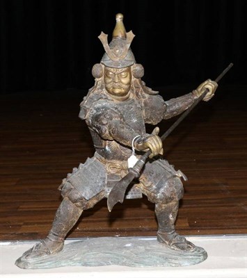 Lot 375 - A Japanese Bronze Figure of a Samurai, Meiji period, standing holding a spear in both hands, on...