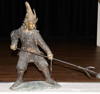 Lot 376 - A Japanese Bronze Figure of a Samurai, Meiji period, standing holding a three-prong spear in...