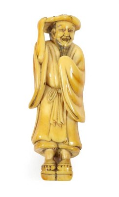 Lot 381 - A Japanese Ivory Netsuke, Edo period, standing holding a lotus leaf on his head, wearing getas...