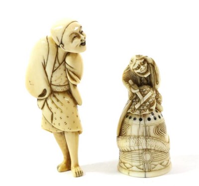Lot 391 - A Japanese Ivory Netsuke, Edo/Meiji period, as a standing figure in loose robes, 7.5cm high;...