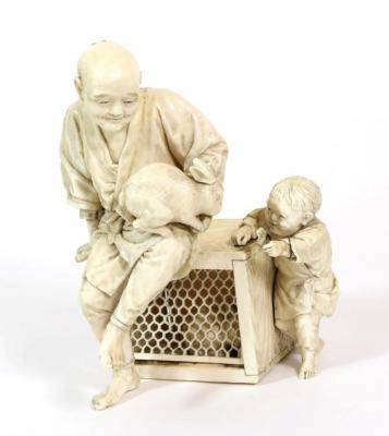 Lot 397 - A Japanese Ivory Okimono, Meiji period, as a man sitting on a cage holding a rabbit on his...