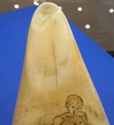 Lot 407 - A Scrimshaw Whale's Tooth, 19th century, engraved with a gentleman falling on his sword,...