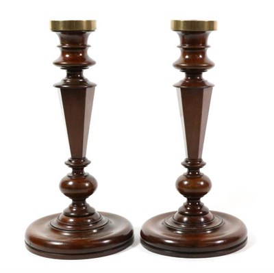 Lot 413 - A Pair of Yew Candlesticks, 19th century, with turned sconces, tapering panelled stems and...