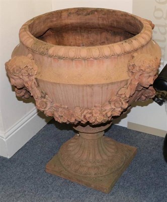 Lot 420 - A Large Terracotta Urn, in neo-classical style, of semi-ovoid form with female masks hung with...
