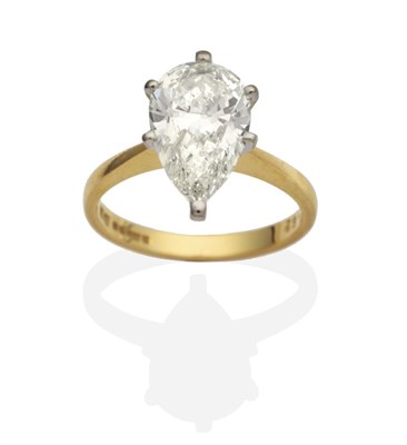 Lot 413 - An 18 Carat Gold Solitaire Diamond Ring, a pear cut diamond in a claw setting, to knife edge...