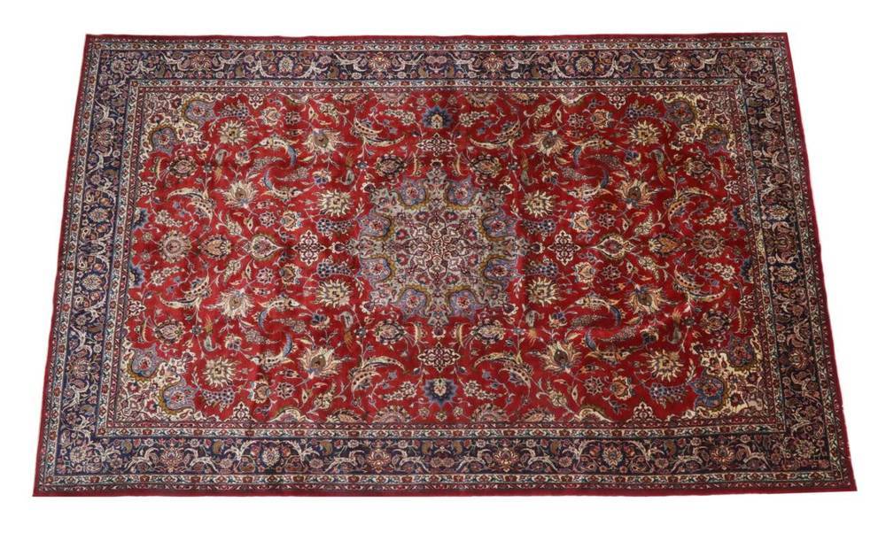 Lot 444 - Large Isfahan Carpet Central Iran, circa 1970 The terracotta field of scrolling floral vines around