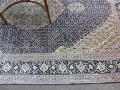 Lot 463 - Tabriz Carpet Iranian Azerbaijan, circa 1970 The midnight blue lattice field with central...