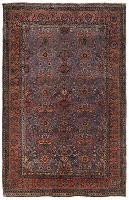Lot 465 - Unusual Carpet, probably Saroukh West Iran, circa 1930 The shaded pale indigo field with a...