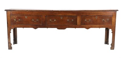 Lot 477 - A Mid 18th Century Oak Low Dresser, the three plank top with cleated ends above three long...