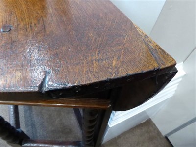 Lot 487 - A Late 17th Century Oak Dropleaf Table, with hinged leaf to form an oval, above a single drawer and