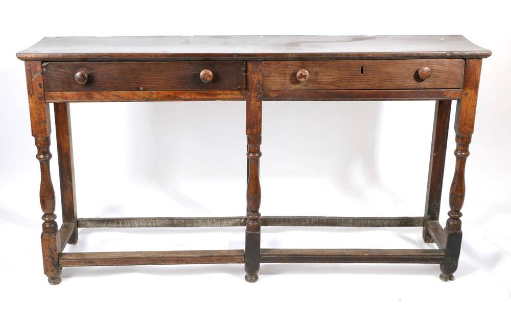 Lot 489 - An Early 18th Century Provincial Oak Low Dresser, with two long drawers above spindle turned...
