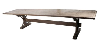 Lot 501 - An Early 18th Century Oak Trestle Form Dining Table, the two plank top joined by cleated ends,...