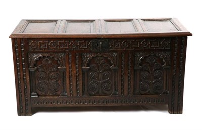 Lot 502 - A Mid 17th Century Joined Oak Chest, the lid with four moulded panels above a geometric carved...