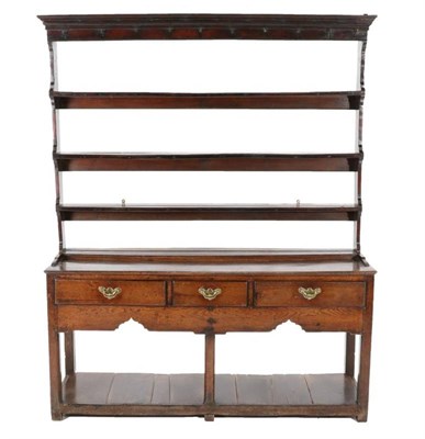 Lot 504 - A Mid 18th Century Oak Dresser and Rack, with three fixed shelves and iron cup hooks, the base...