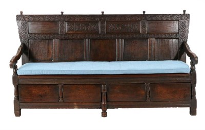 Lot 509 - A 17th Century Joined Oak Settle, carved with initials SM and dated 1691, the lunette and guilloche
