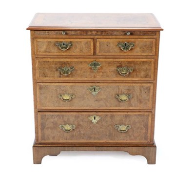 Lot 513 - A Burr Walnut, Crossbanded and Featherbanded Bachelor's Dressing Chest, the moulded top above a...